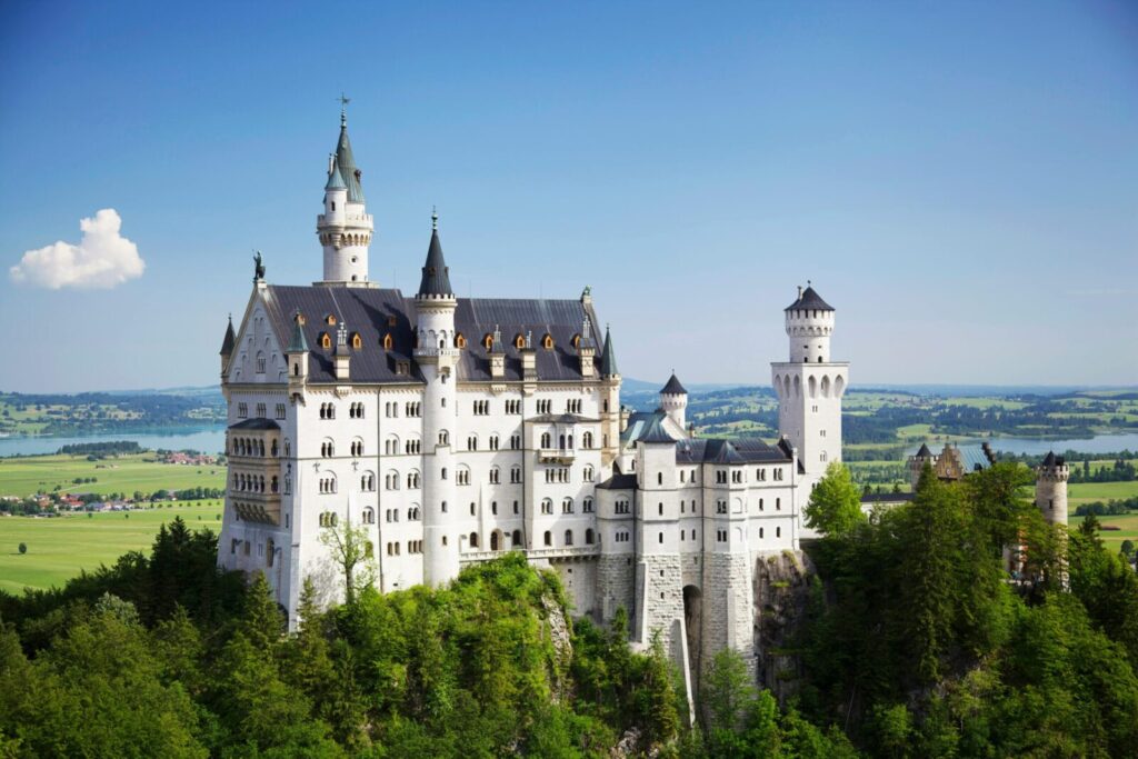 A stunning view of Neuschwanstein Castle amidst Bavaria's lush landscapes.